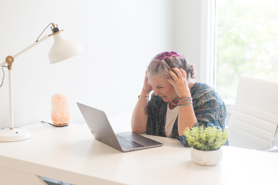 Frustrated creator at a laptop for the why channels fail article